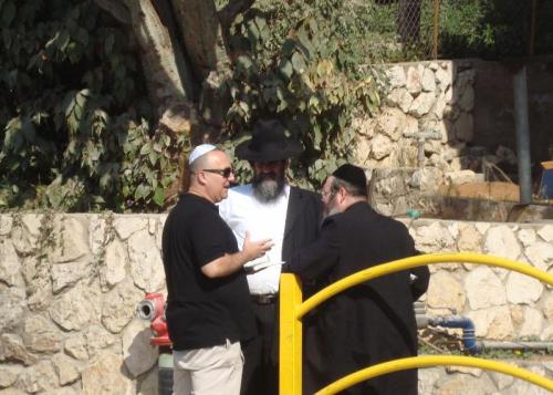 Zev speaking with orthodox men