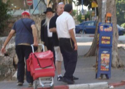 speaking to men on street corner
