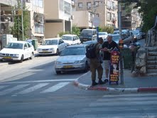 Speaking to man on street corner