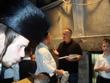 Zev speaking to man with chicken 2