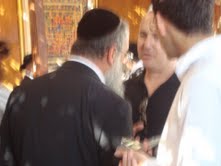 Zev speaking with another man