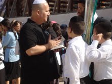 Zev sharing with man and boys