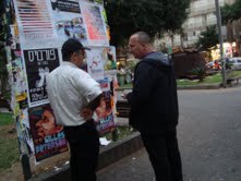 Zev with man near posters
