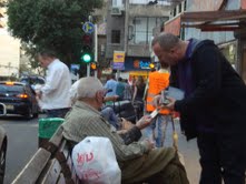 Zev sharing with elderly couple on bench