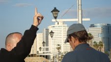 Zev pointing up to man