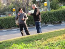 Zev with man in parking lot